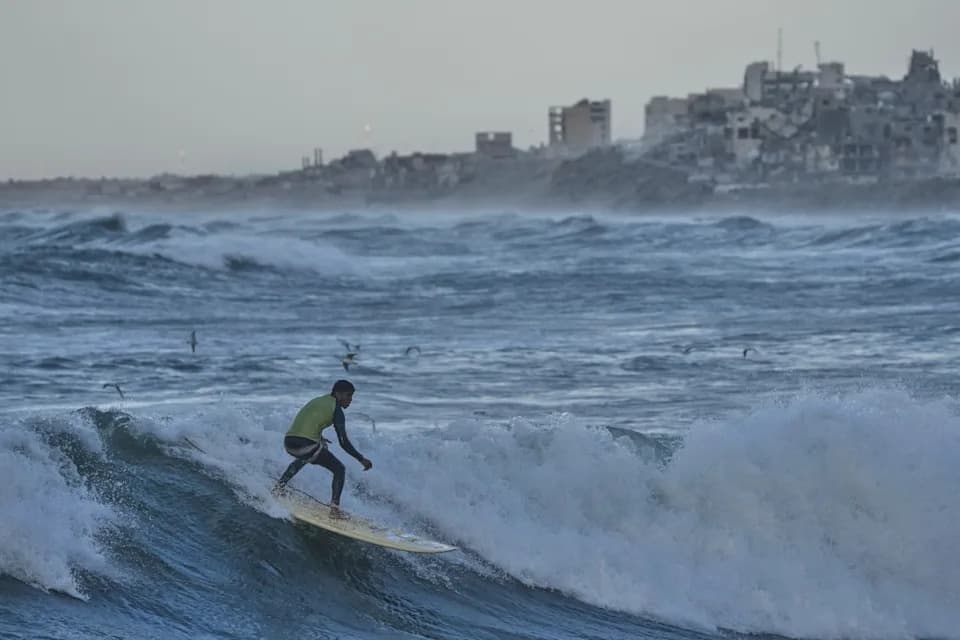 Against the Odds: Surfers Ride Waves Along Gaza City's War-Damaged Shoreline