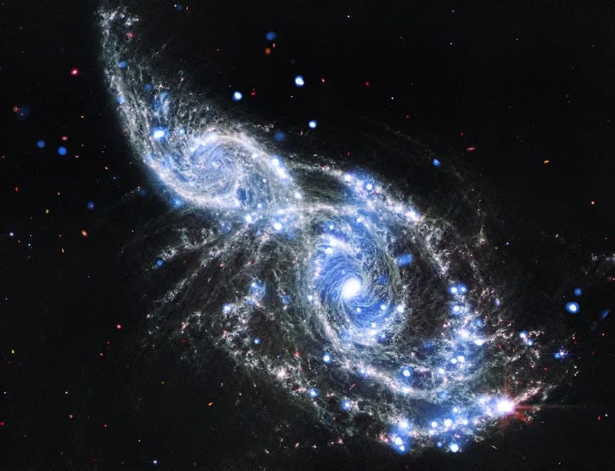 NASA Combines JWST and Chandra Images to Reveal Two Spiral Galaxies Colliding in Rich Detail