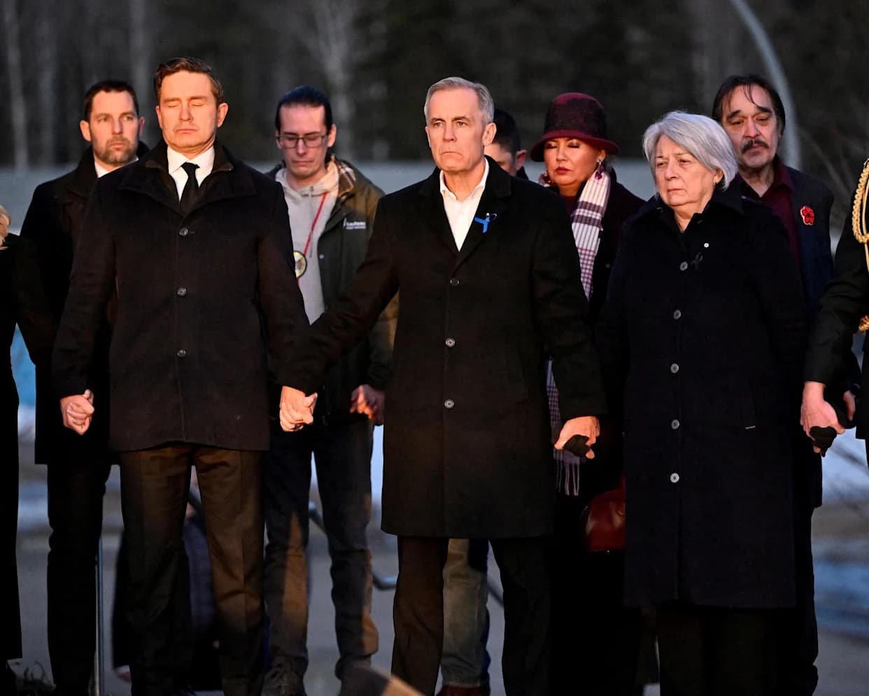 Trudeau and Poilievre Unite at Candlelight Vigil in Tumbler Ridge After Deadly School Shooting