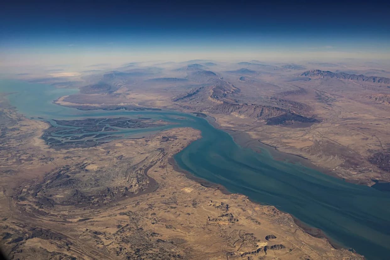 Iran Partially Closes Strait of Hormuz During Geneva Nuclear Talks; Oil Prices Ease