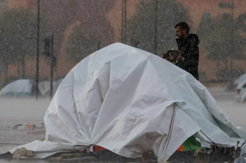 Heavy Rain Forces Displaced Lebanese to Shelter Under Tarpaulins and Truck Beds as Shelters Overflow