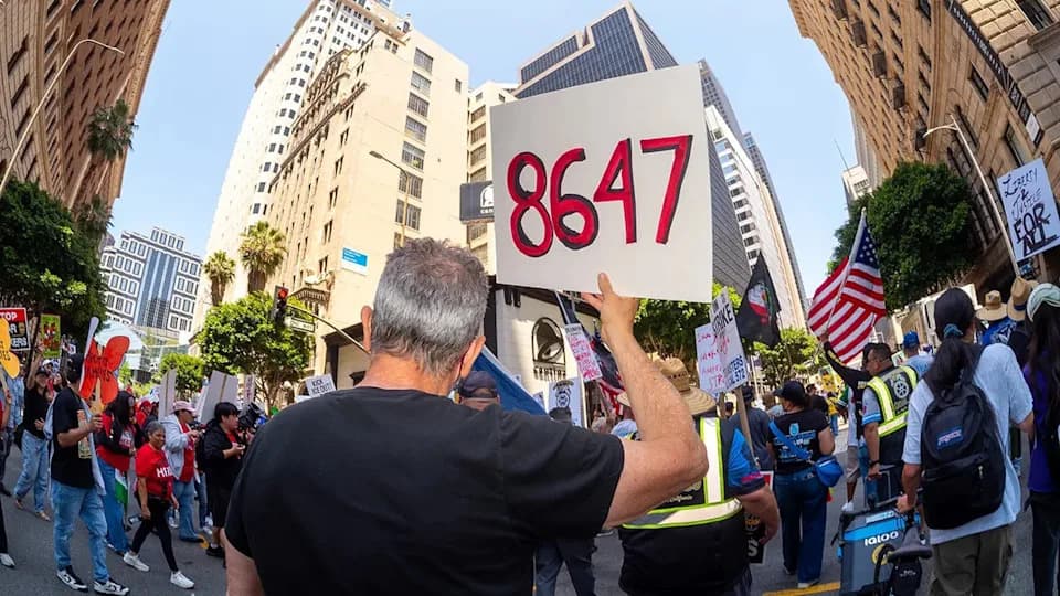 “86 47” Slogan Reappears at May Day Protests as Comey’s Instagram Post Sparks DOJ Indictment