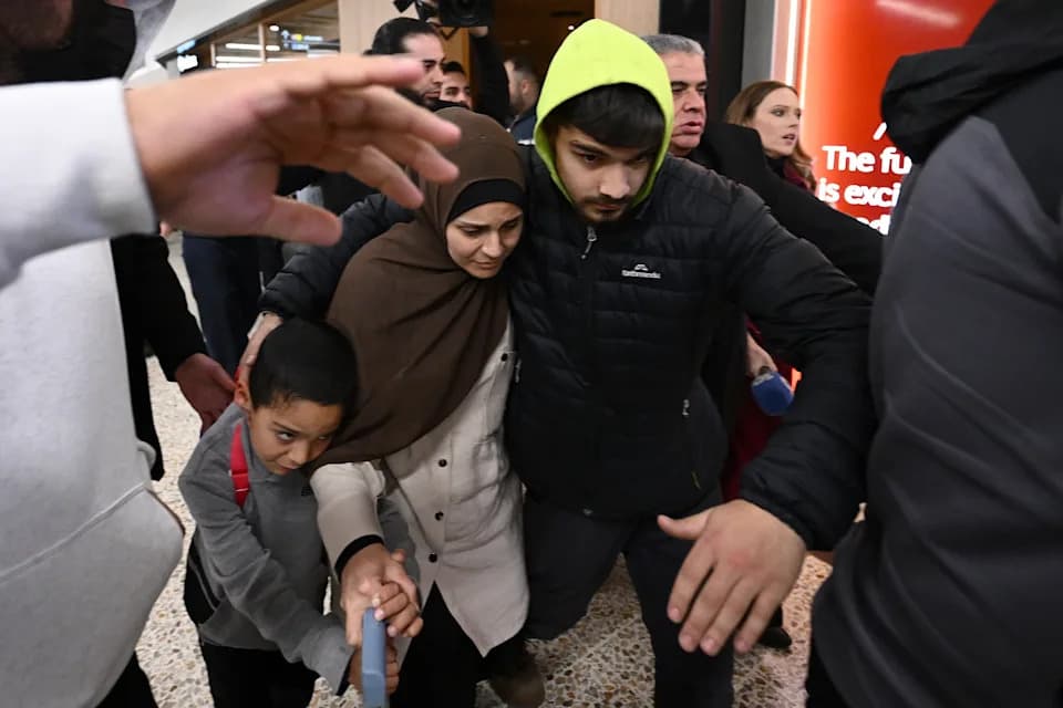 Seven Women and 12 Children Linked to Islamic State Flown Home to Melbourne; More Due in Sydney
