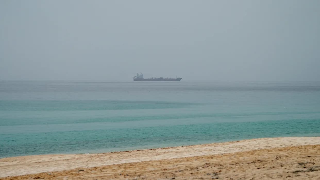 Iran Strikes Cargo Ship in Strait of Hormuz — UN Pauses Evacuations, Oil Edges Up