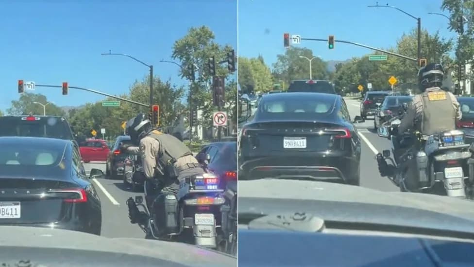 Tesla Driver So Fixated on Phone That Motorcycle Cop Films Him Through Passenger Window