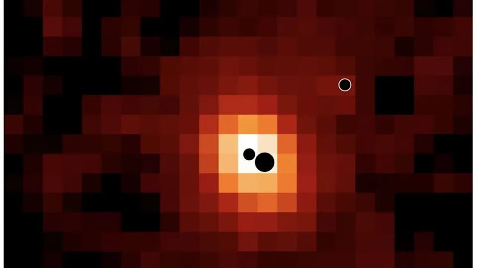 Three Supermassive Black Holes Poised For Possible Merger In Distant Galaxy J0148-4214
