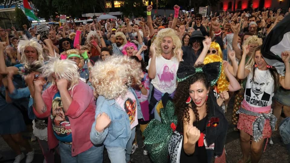 Queensland Flash Mob Reclaims John Farnham Karaoke Hit After Slogan Ban