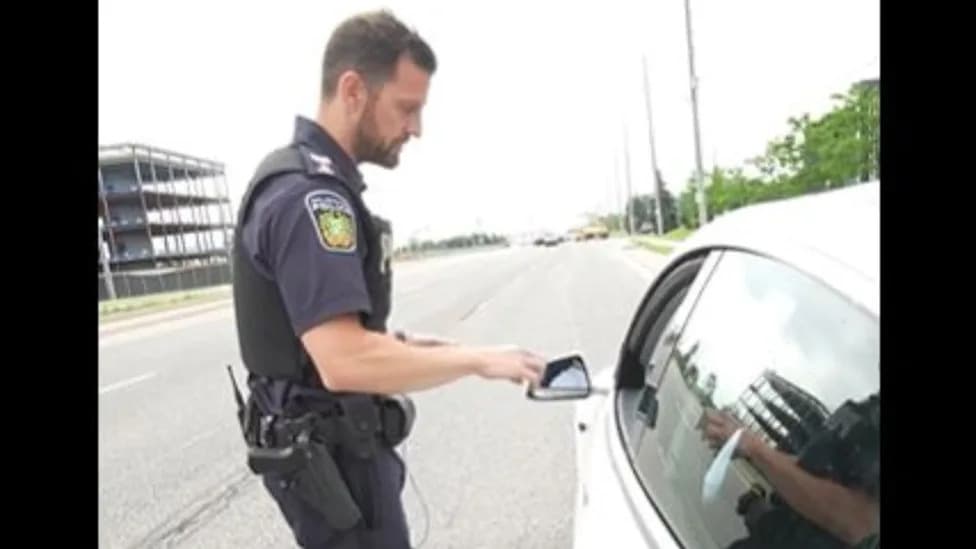 "That's The Law": Officer Issues $615 Ticket For Holding Phone At Red Light, Video Sparks Debate