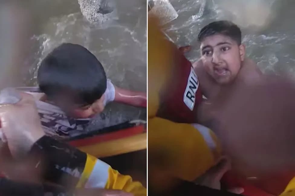 Helmet-Cam Footage Shows RNLI Lifeboat Rescue Two Boys Trapped Under Blackpool Pier During Surging Tide