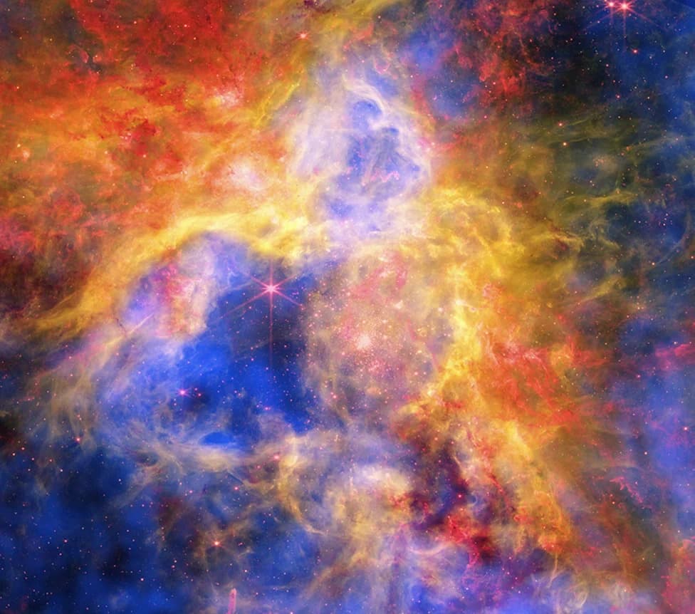 NASA Unveils Vivid Composite Image of the Tarantula Nebula — Thousands of Young Stars Revealed