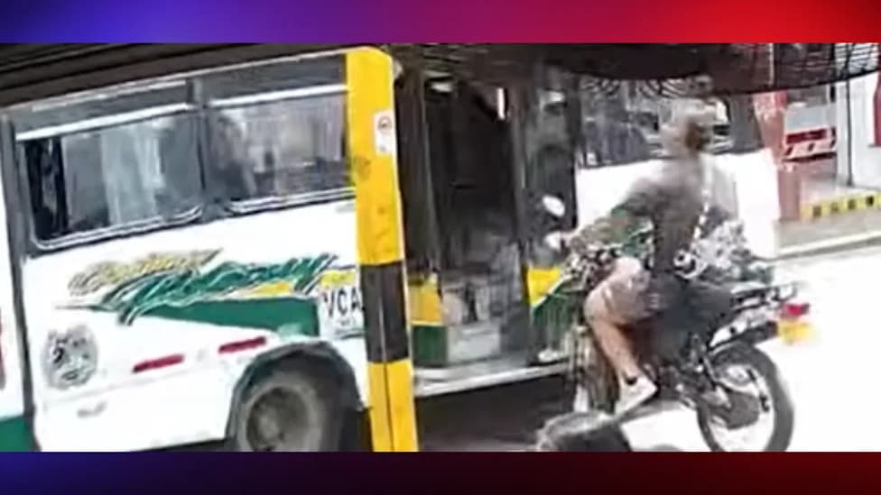 Motorcyclist Flung Through Open Bus Door After Running Stop Sign in Colombia, Walks Away With Minor Injuries