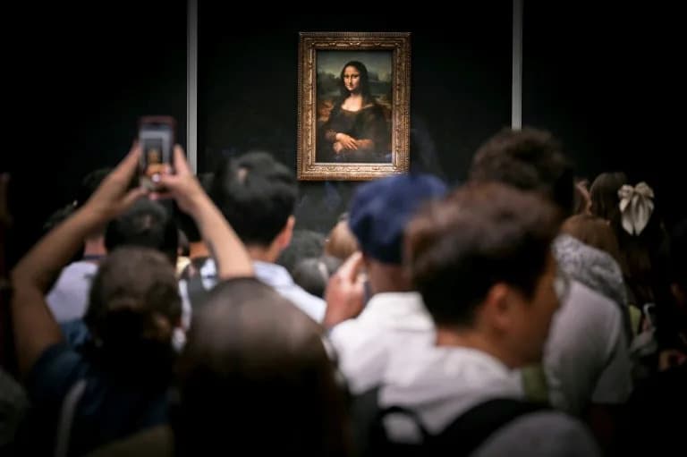 Two Germans Arrested After Taping Paintings To Wall In Louvre's Mona Lisa Gallery